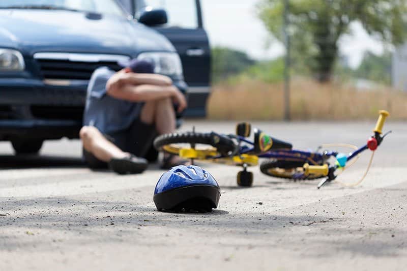 A bicycle accident on the side of the road.